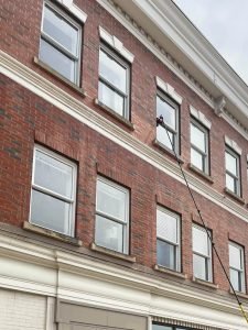 Photo of commercial windows being cleaned by Superior